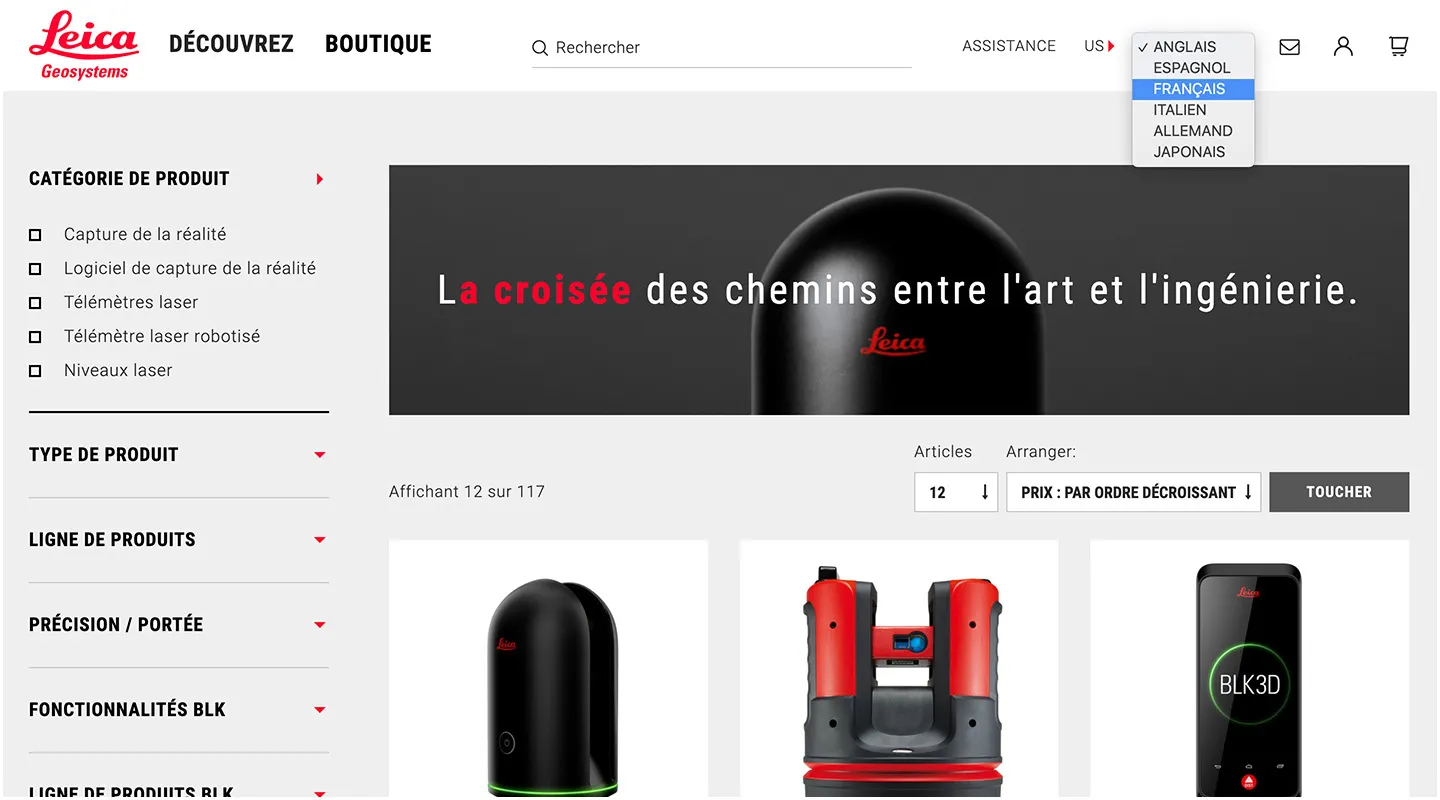 The Leica shop in French — Découvrez and Boutique in the navigation, a language menu open on Anglais, Espagnol, Français, Italien, Allemand and Japonais, over a hero reading “La croisée des chemins entre l’art et l’ingénierie” and a filtered product grid.